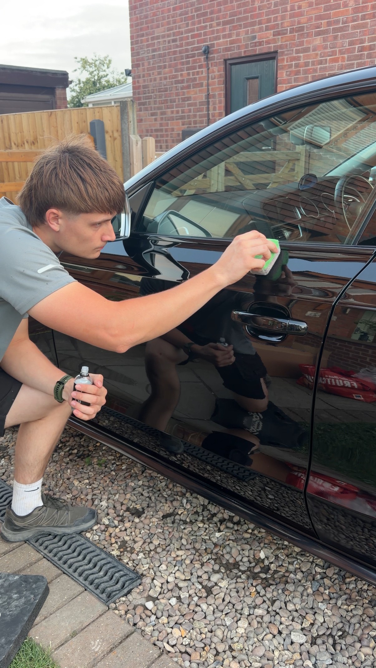 Riches Valeting applying protective product to a car door