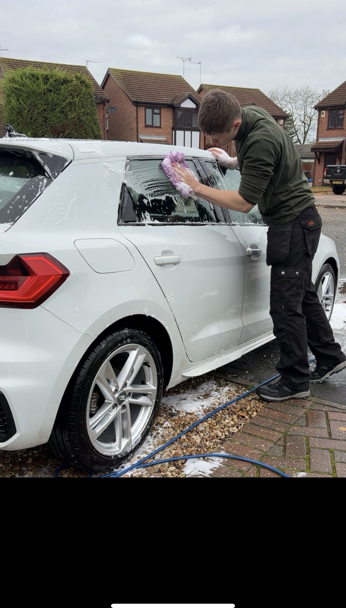 Riches Valeting washing a customer's car